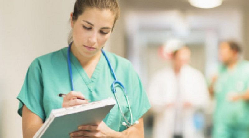 USA, New Jersey, Jersey City, Female doctor in hospital hallway