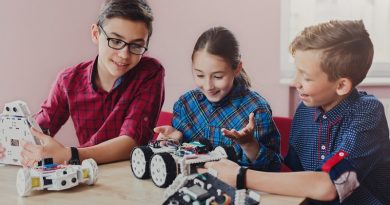 Children creating robots at school, stem education, copy space. Early development, diy, innovation, modern technology concept