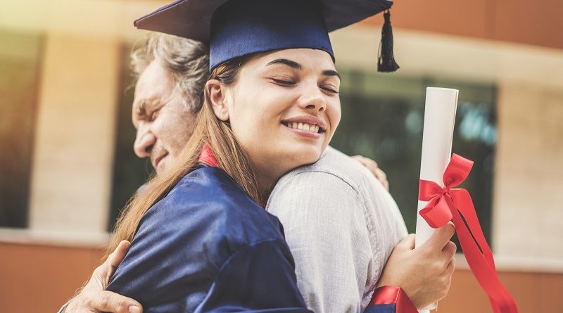 Graduated student hugging her father