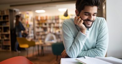 Student preparing exam and learning lessons in college library