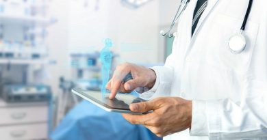 Smart health care internet of things and hospital automation management , Artificial intelligence hologram robot adviser technology concept. Doctor with Stethoscope using tablet for remote monitoring.