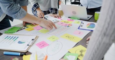 Group of casually dressed business people discussing ideas in the office. Creative professionals gathered at the meeting table for discuss the important issues of the new successful startup project.