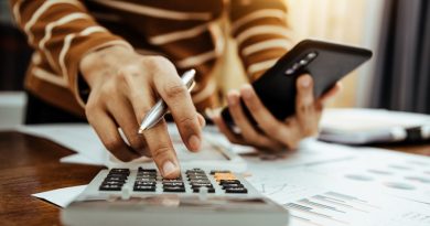 Female accountant or banker making calculation of finance and economy banking concept.